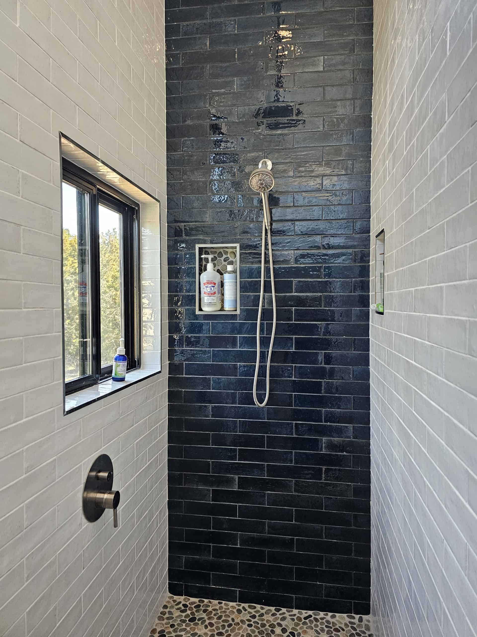 Tiled shower in tiny house bathroom