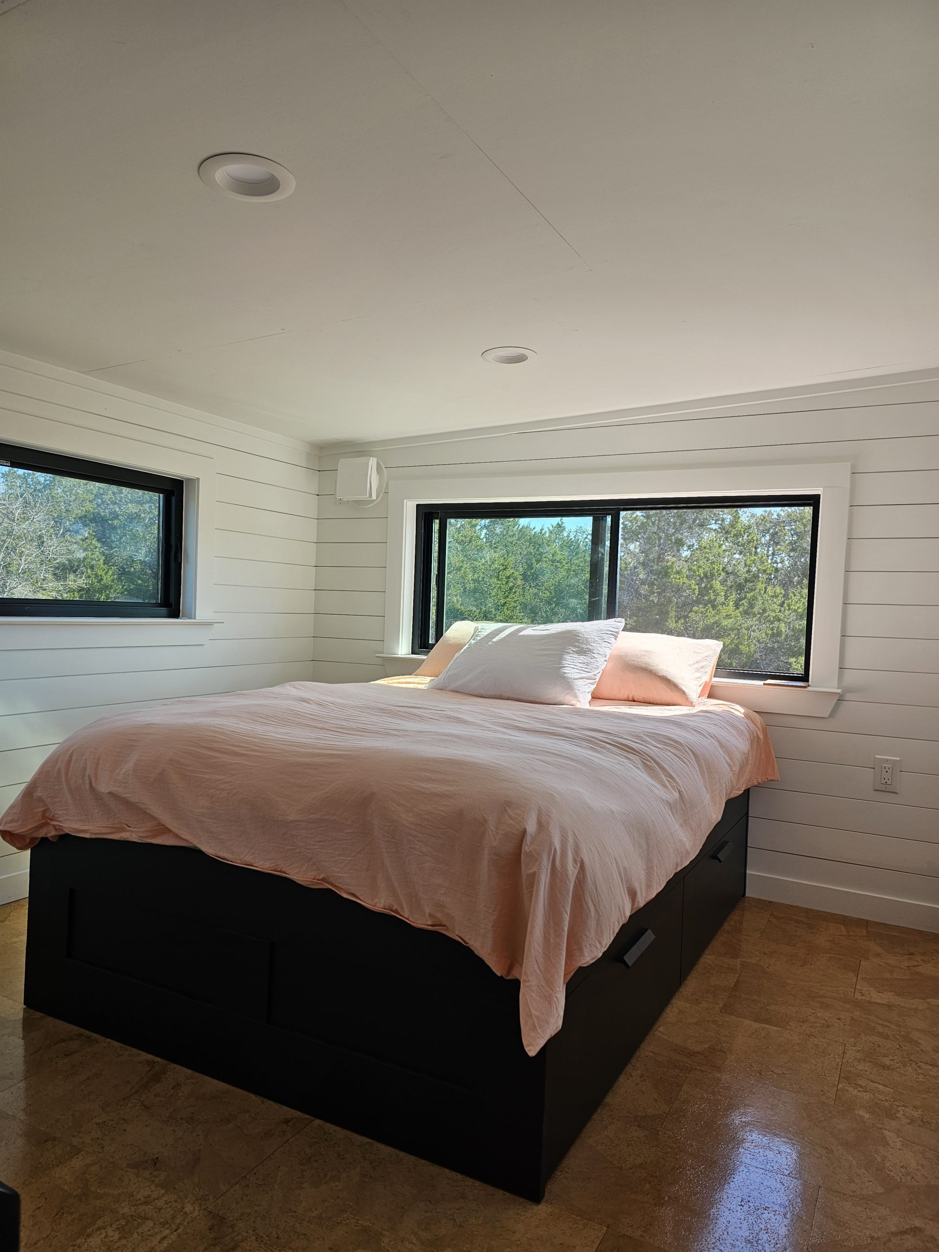 Gooseneck bedroom with standing room and large windows