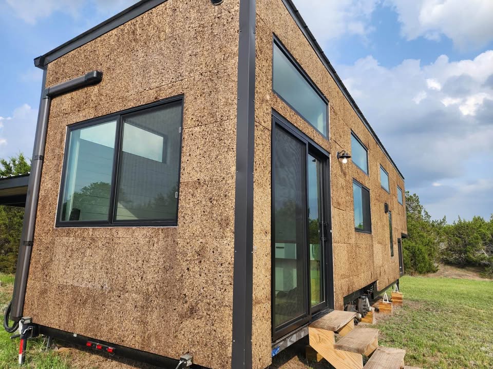 Exterior of custom tiny house with cork siding